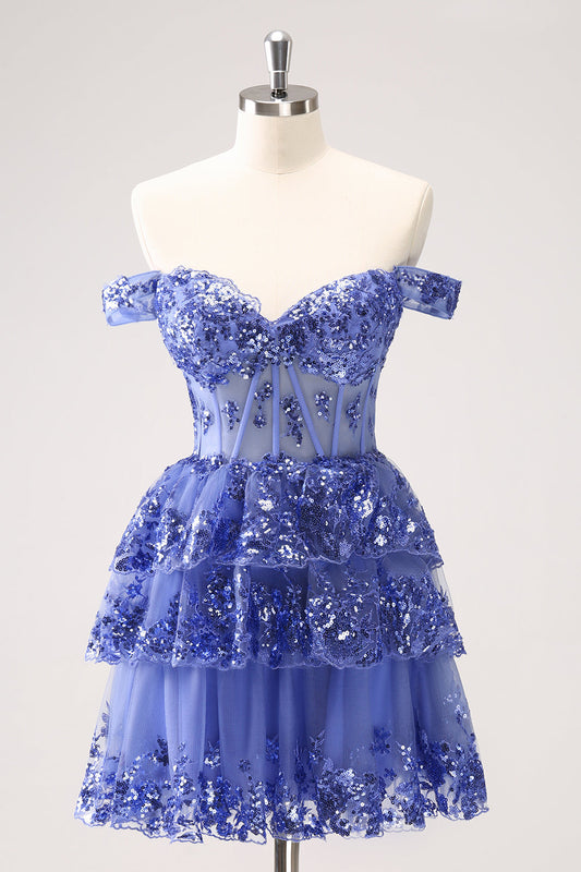 Robe de bal bleu foncé scintillante coupe trapèze avec corsage dénudé aux épaules et volants