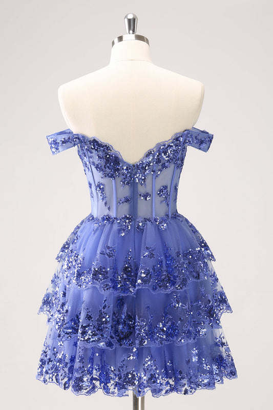 Robe de bal bleu foncé scintillante coupe trapèze avec corsage dénudé aux épaules et volants