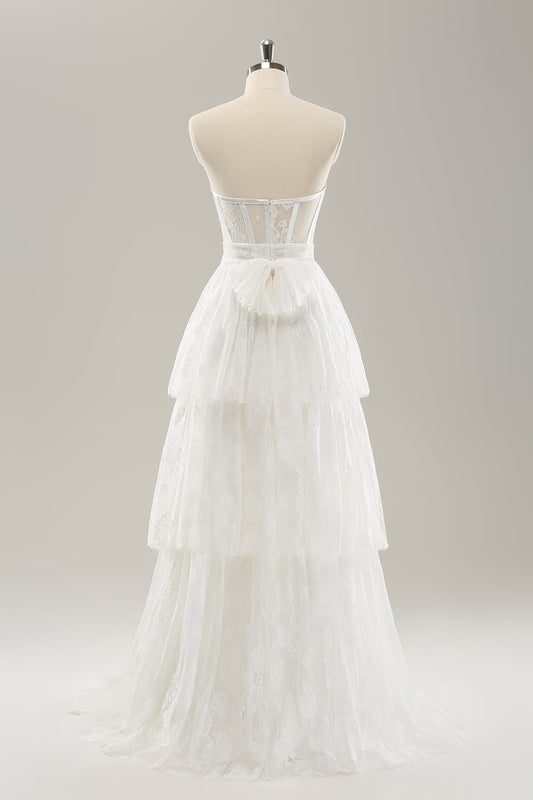Robe de mariée longue bustier blanche à volants