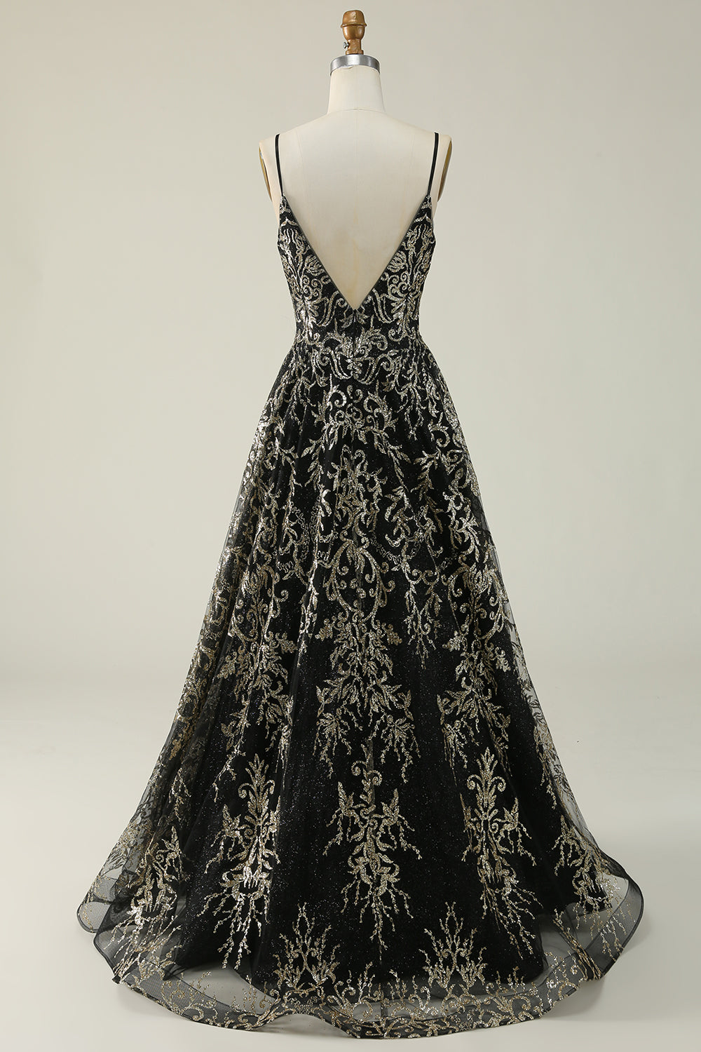 Robe longue de bal noire et dorée à fines bretelles