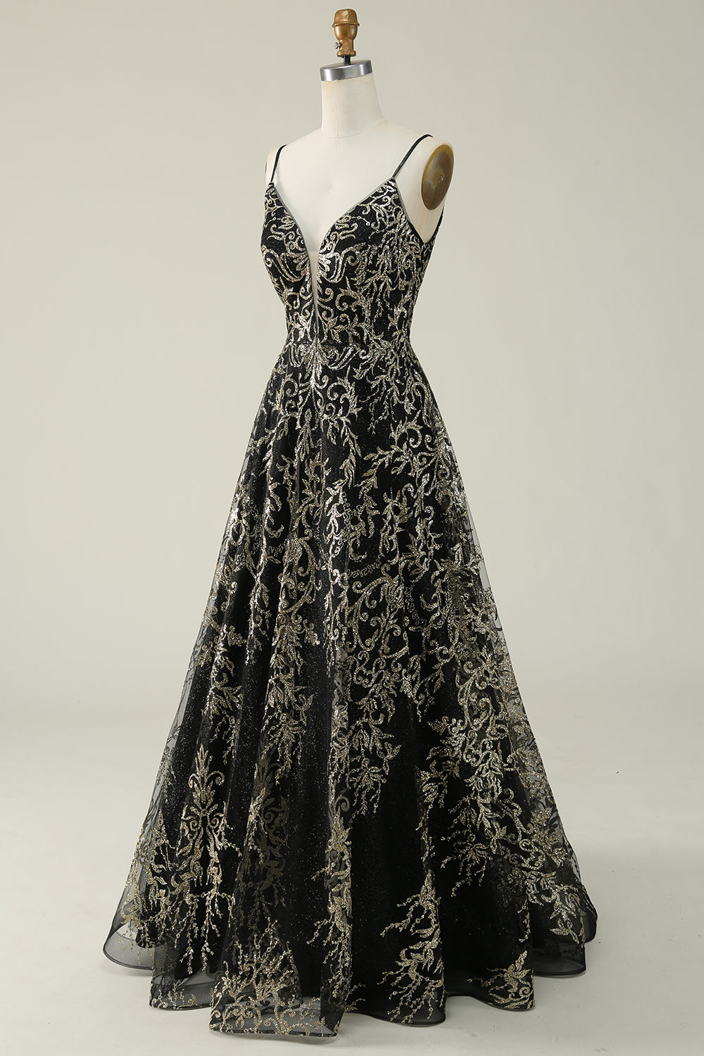 Robe longue de bal noire et dorée à fines bretelles