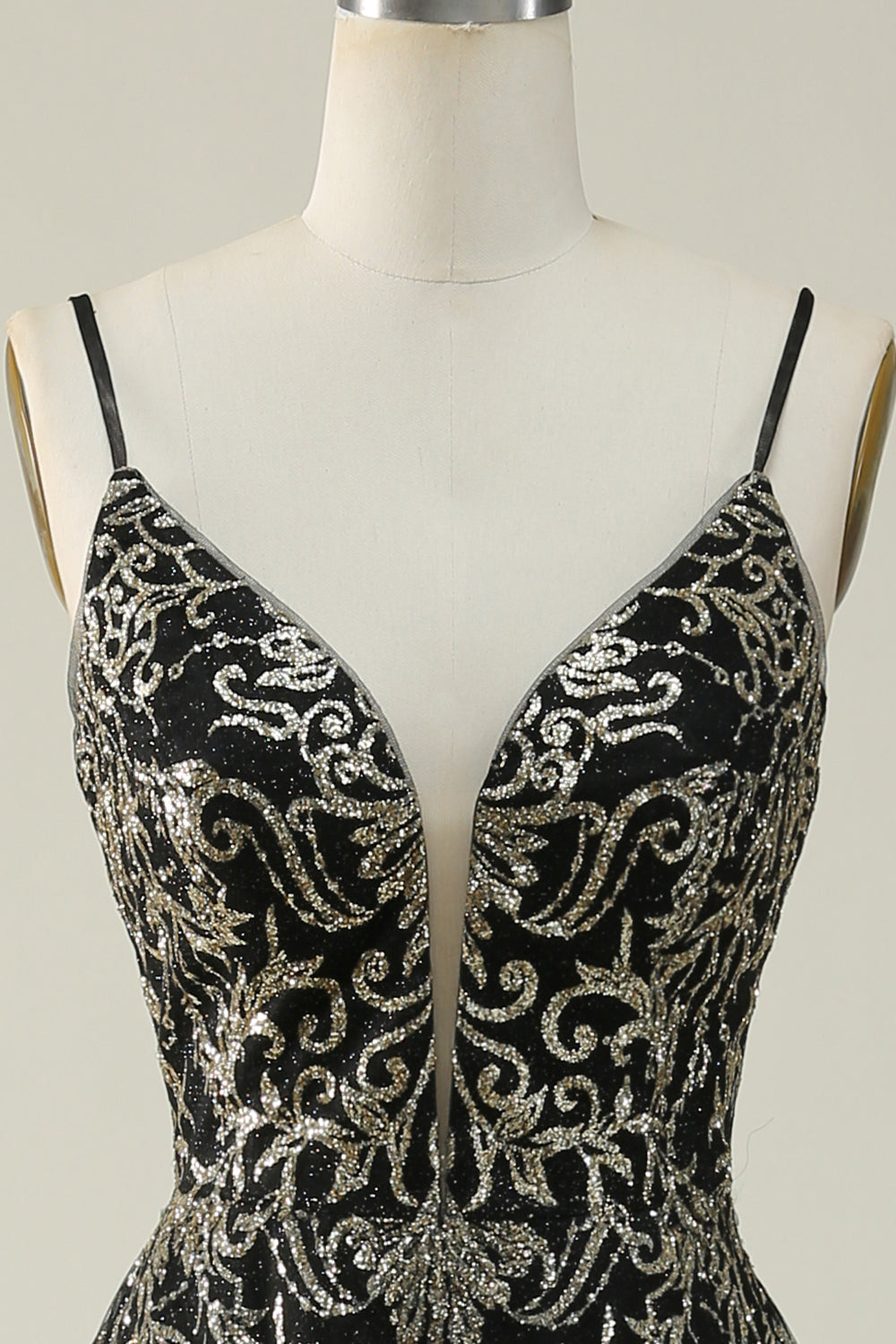 Robe longue de bal noire et dorée à fines bretelles